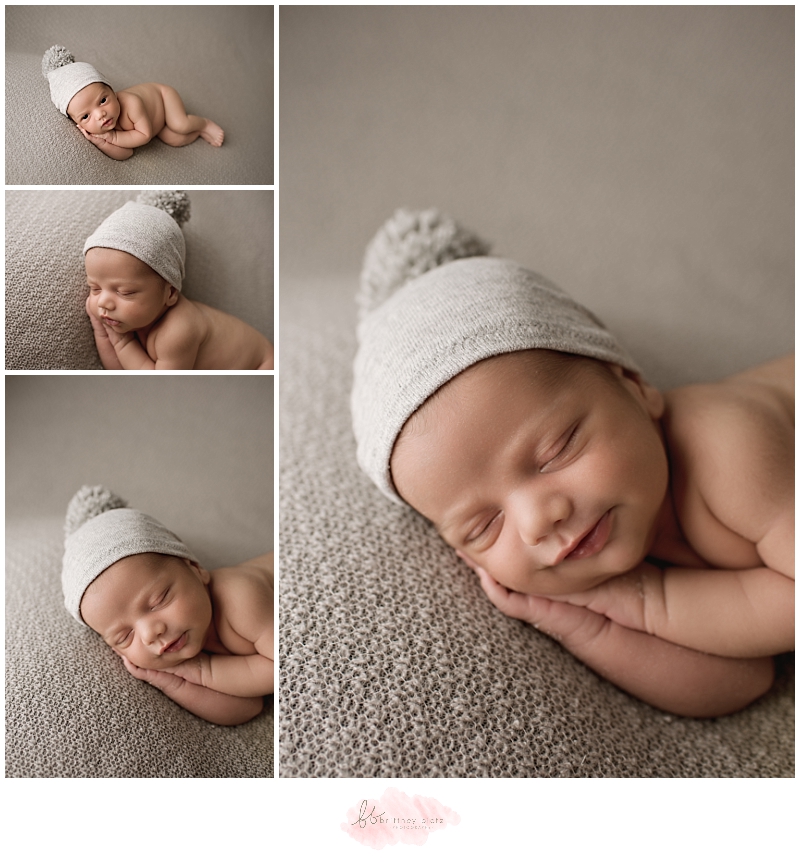 Calgary newborn photographer baby boy smiles