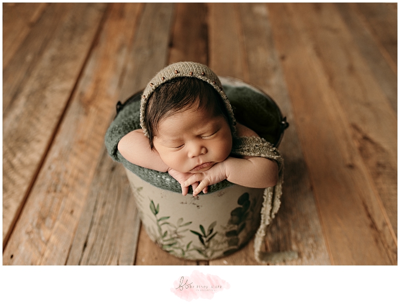 Calgary baby boy in green bucket with hat