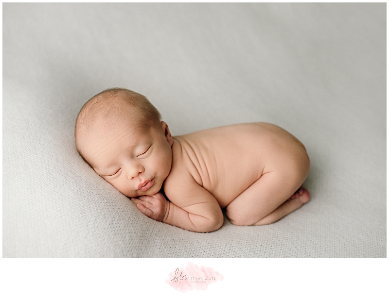 Calgary newborn photographer baby boy pucker