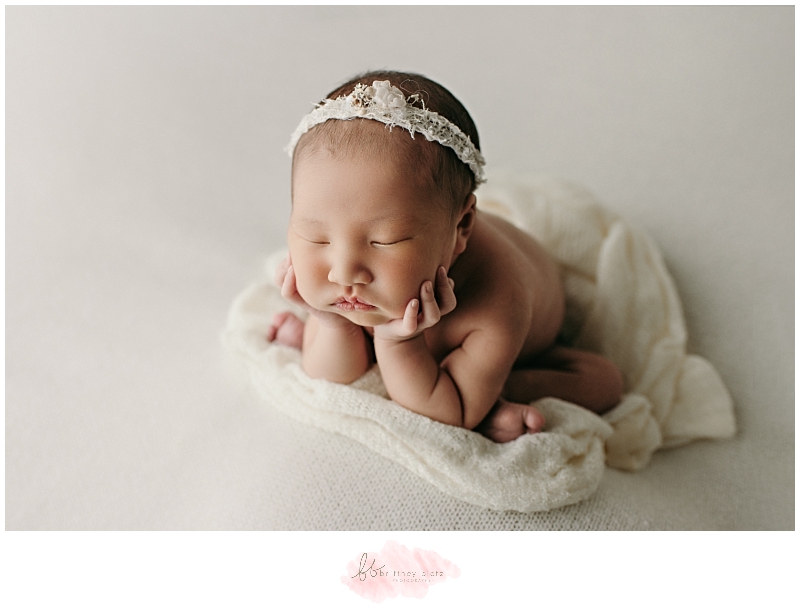 Calgary newborn photo baby girl in froggy pose from the side