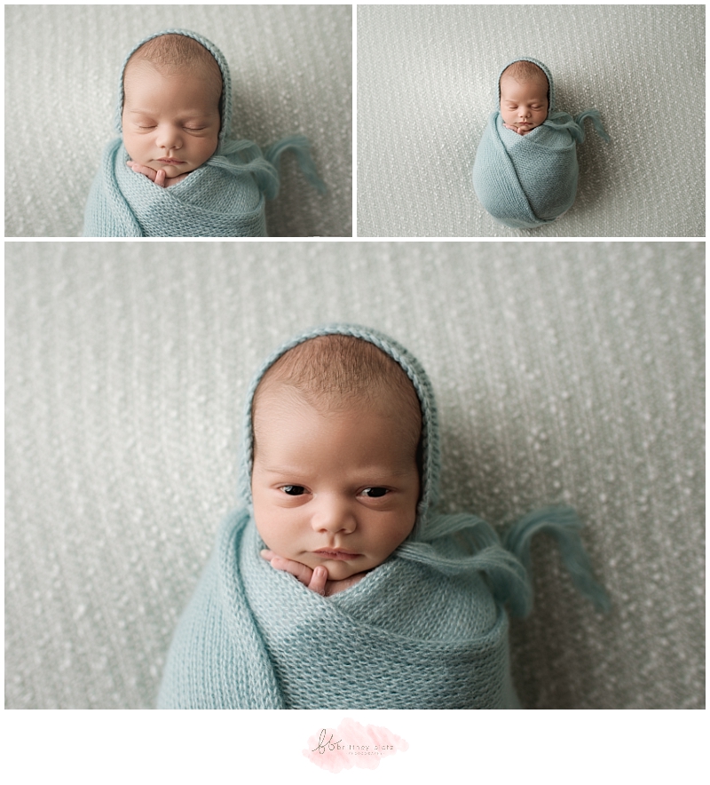 Calgary newborn photographer baby boy wide eyed in green