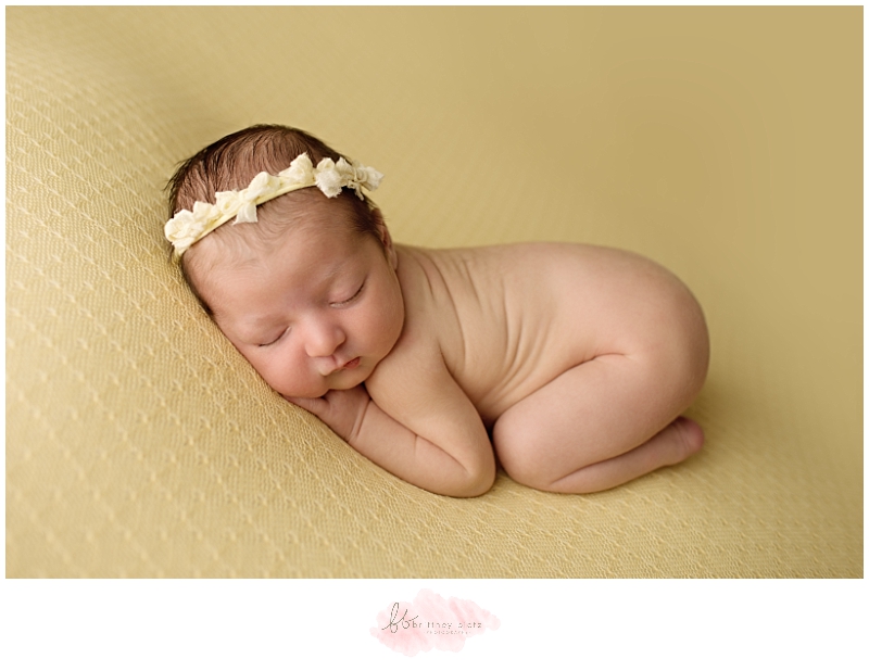 Calgary Newborn Photographer baby girl on yellow