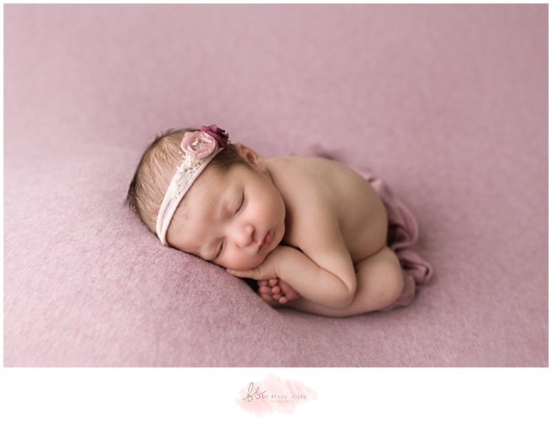 Calgary Newborn Photographer baby girl on pink taco pose